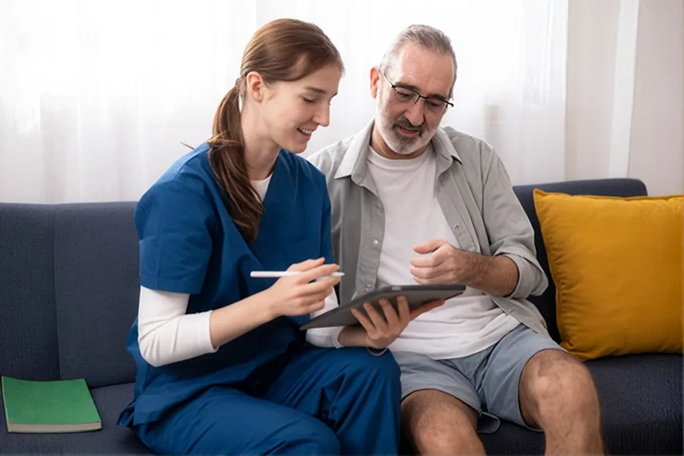A nurse going through a patient's recovery record with them